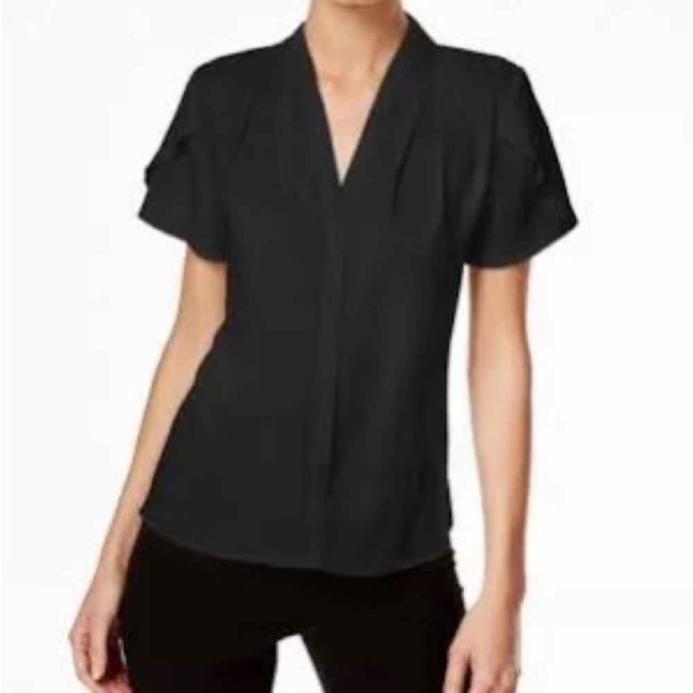 NWT. Women’s short-sleeve Calvin Klein suit blouse. Size S. Black. Polyester.